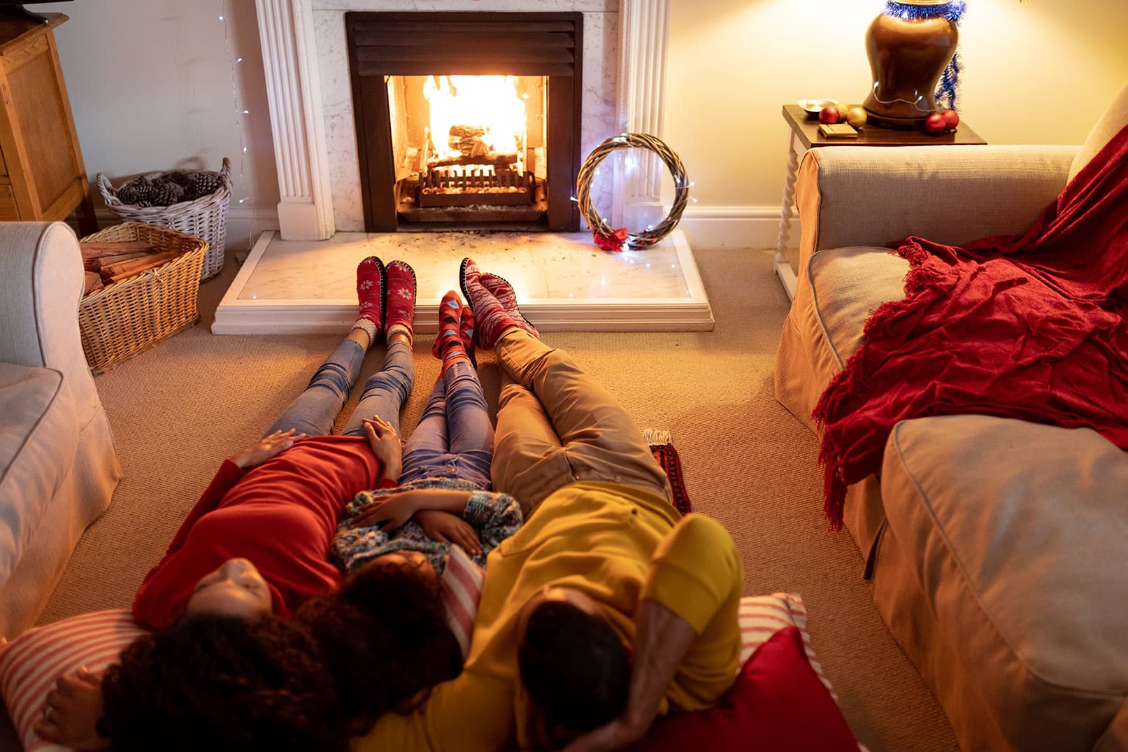 family laying on the floor staying warm thanks to abs heating & air ocala